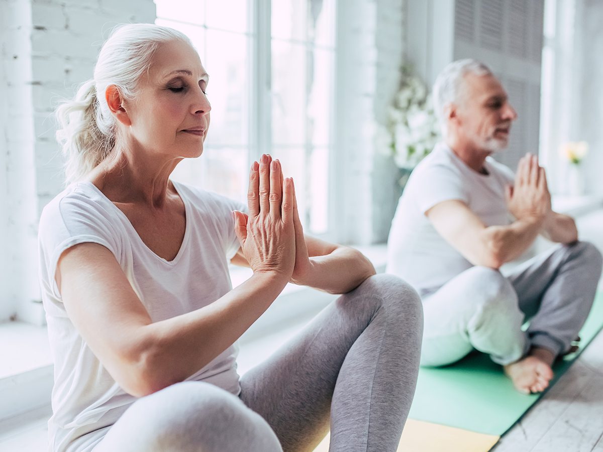 Things that slow down aging - senior couple meditating