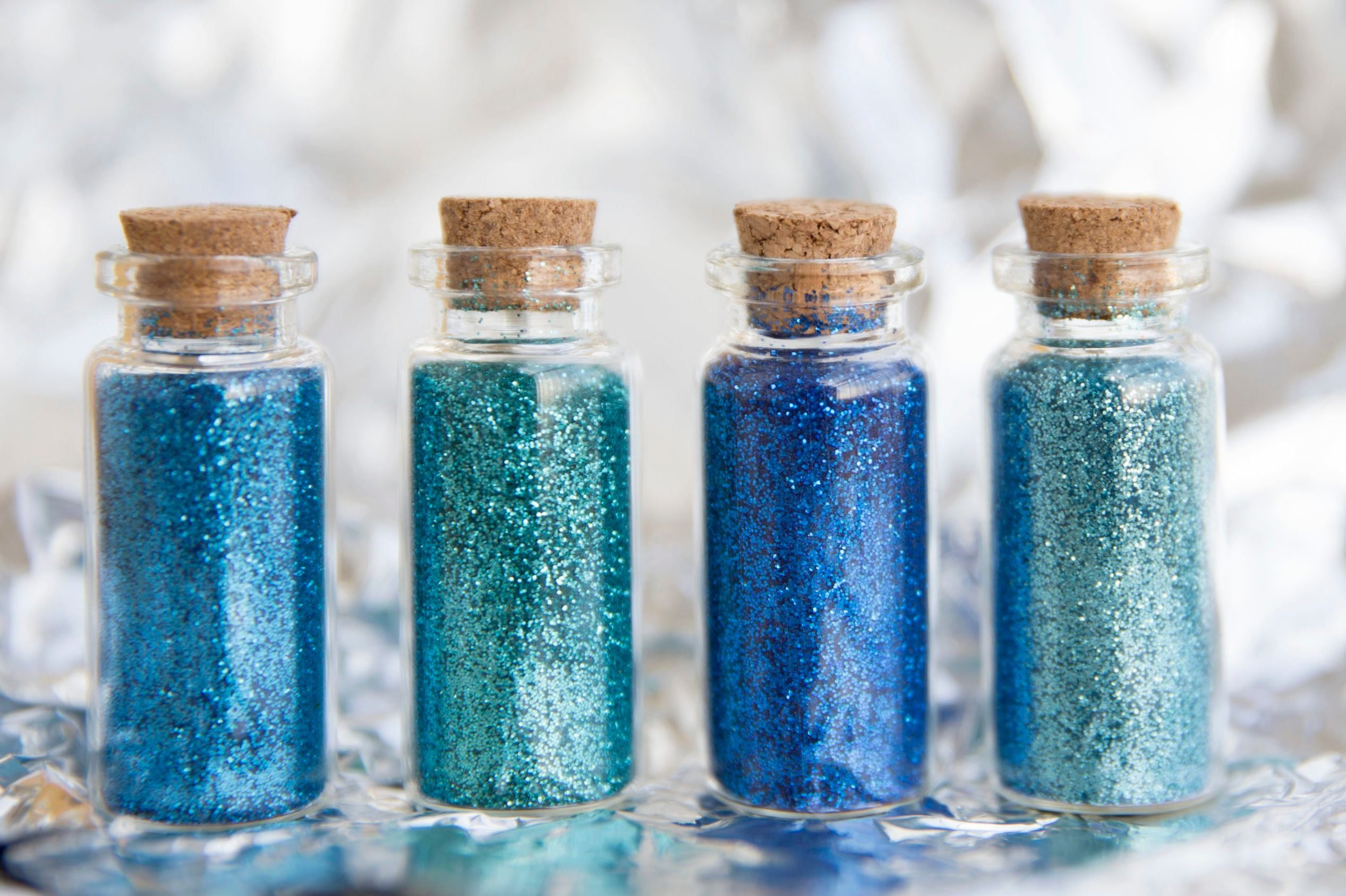 Close-Up Of Glitter Bottles On Table