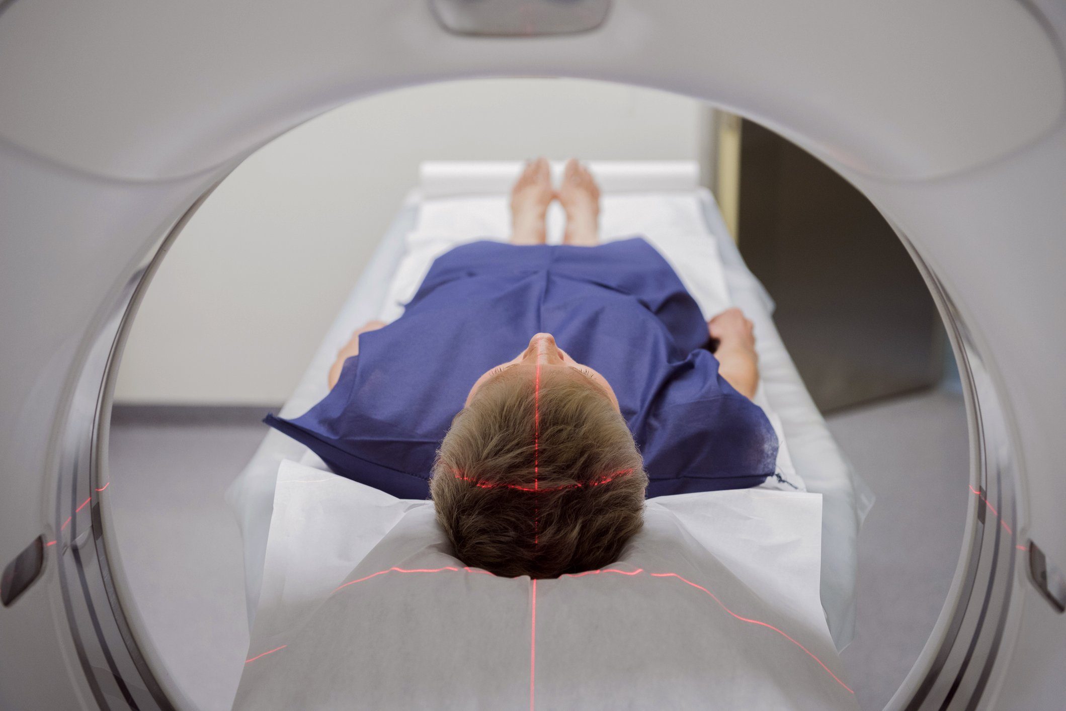 person laying in medical machine getting a brain scan