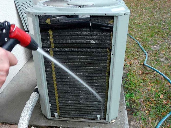 Cleaning outdoor air conditioner unit