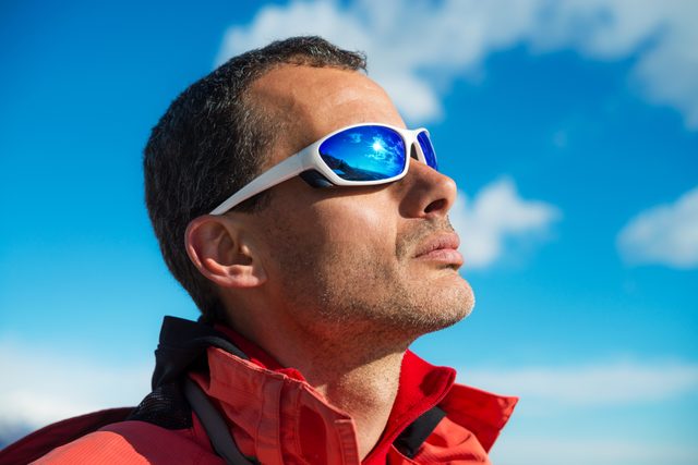 Sunglasses myths - Man wearing sports sunglasses outside