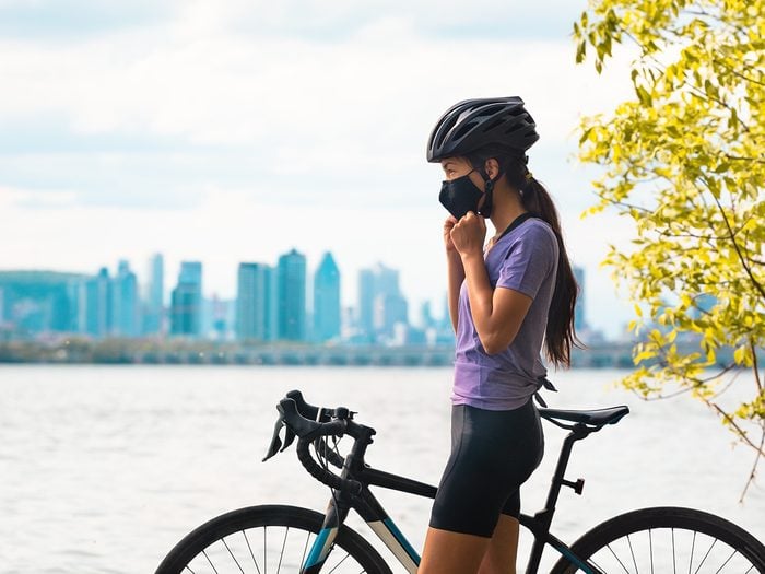 Summer Canada 2021 forecast - Montreal woman on bike in mask
