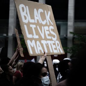 A protestor holds a sign at the Not Another Black Life protest in Toronto on May 30, 2020