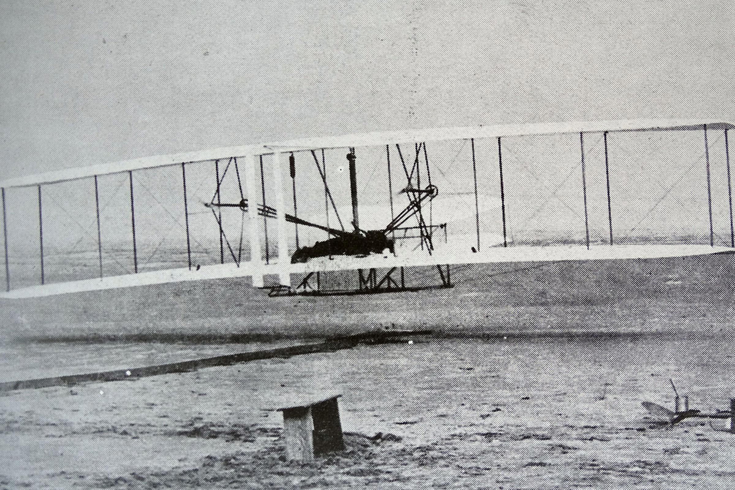 The 'Flyer' makes a perfect take-off. Orville Wright, arranged that this photograph would be taken of the first controlled, sustained and powered heavier-than-air flight. 17th December, 1903.