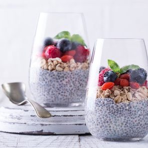 foods everyone over 50 should be eating - Healthy breakfast or morning snack with chia seeds pudding, granola and berries, vegetarian food, diet and health concept