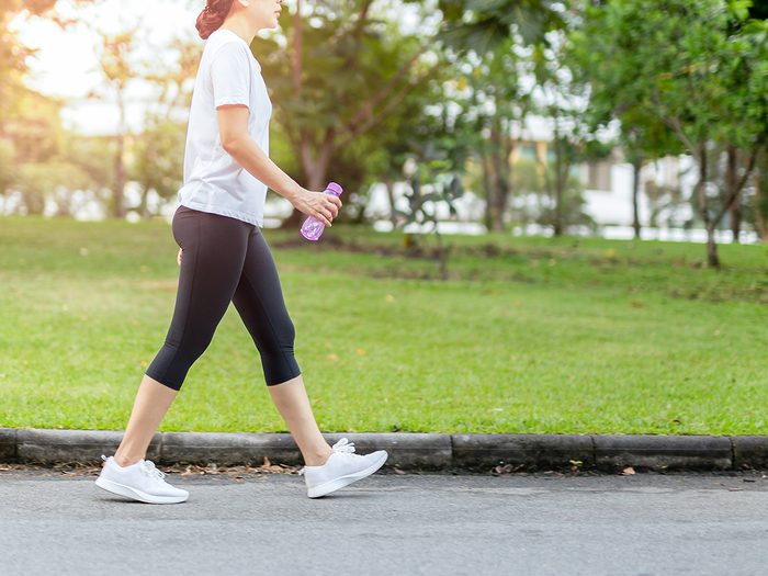 How to make walking less boring - woman walking in park