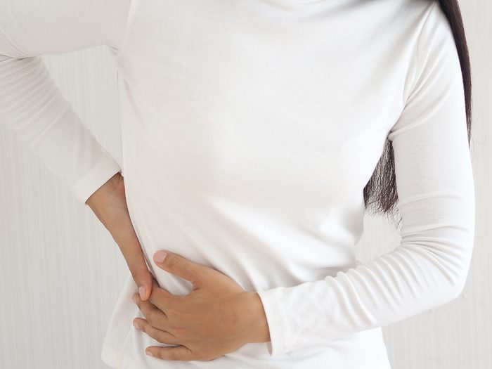 What causes Shingles - woman in pain