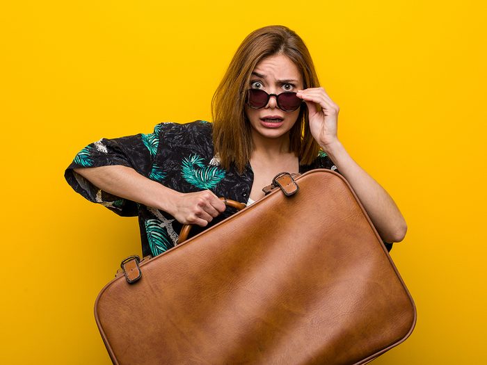 Hilarious tweets - woman with emotional baggage carrying suitcase