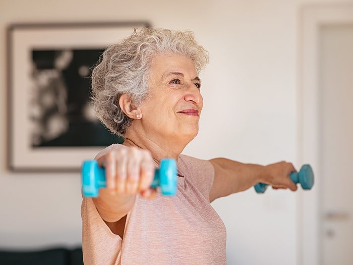 Senior woman lifting weights