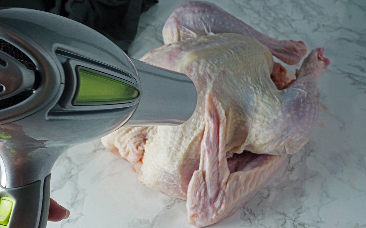 use a hair dryer to make a Thanksgiving turkey skin extra crispy