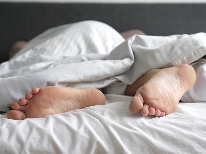 Secrets to a good night's sleep - feet in bed