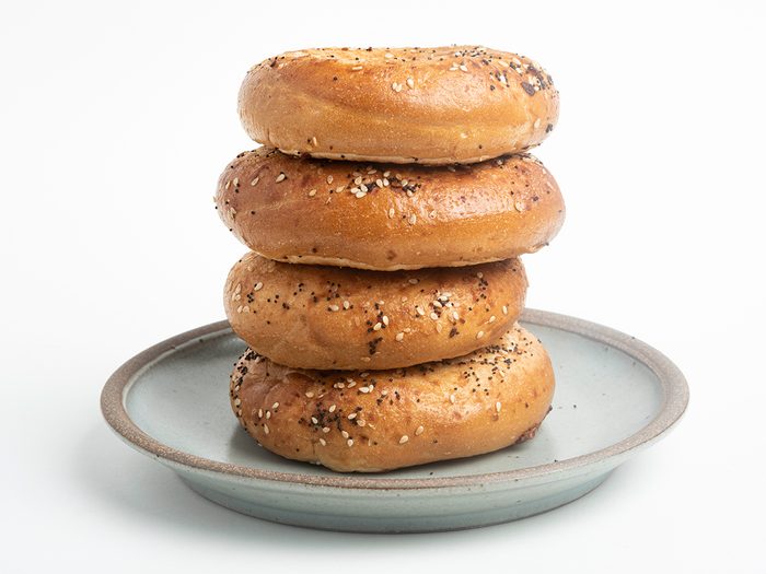 Stack of bagels on plate