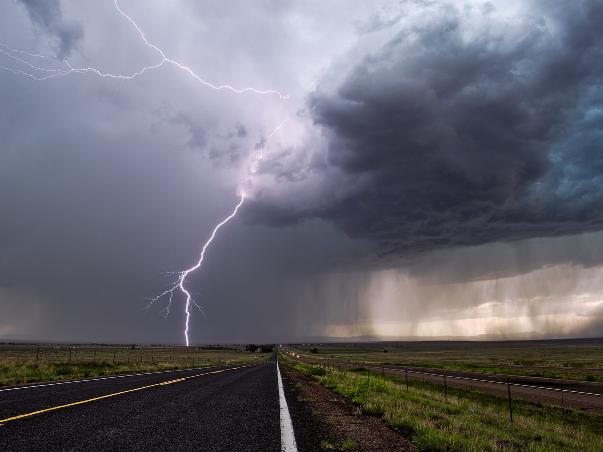 Lightning flash on desolate road