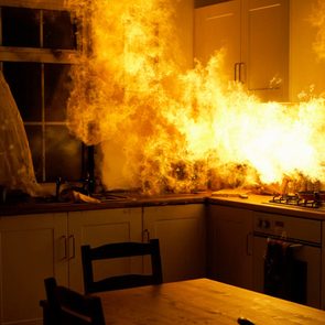 Home fire hazards - Fire raging in domestic kitchen at night