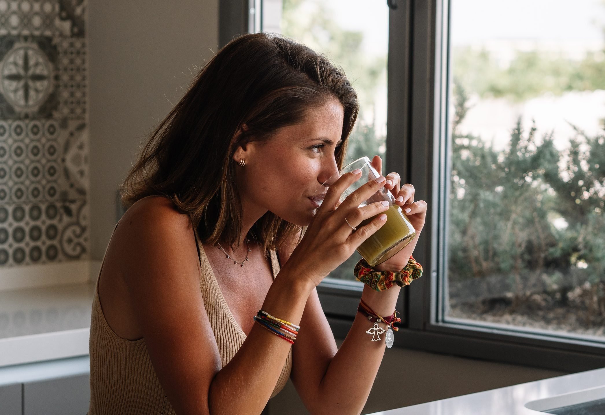 Healthy Booze Alternatives - Woman drinking smoothie