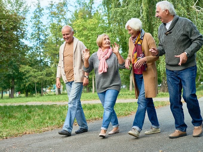 Risk factors for heart disease - four seniors being active walking