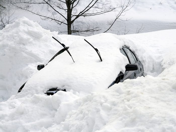 Car buried in snow