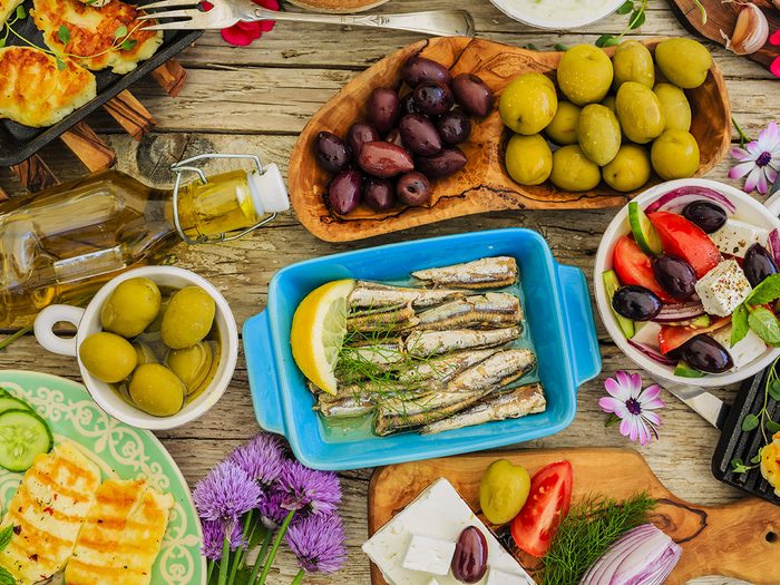 Greek cuisine dishes - feta, choriatiki, halloumi, tzatziki, sardines