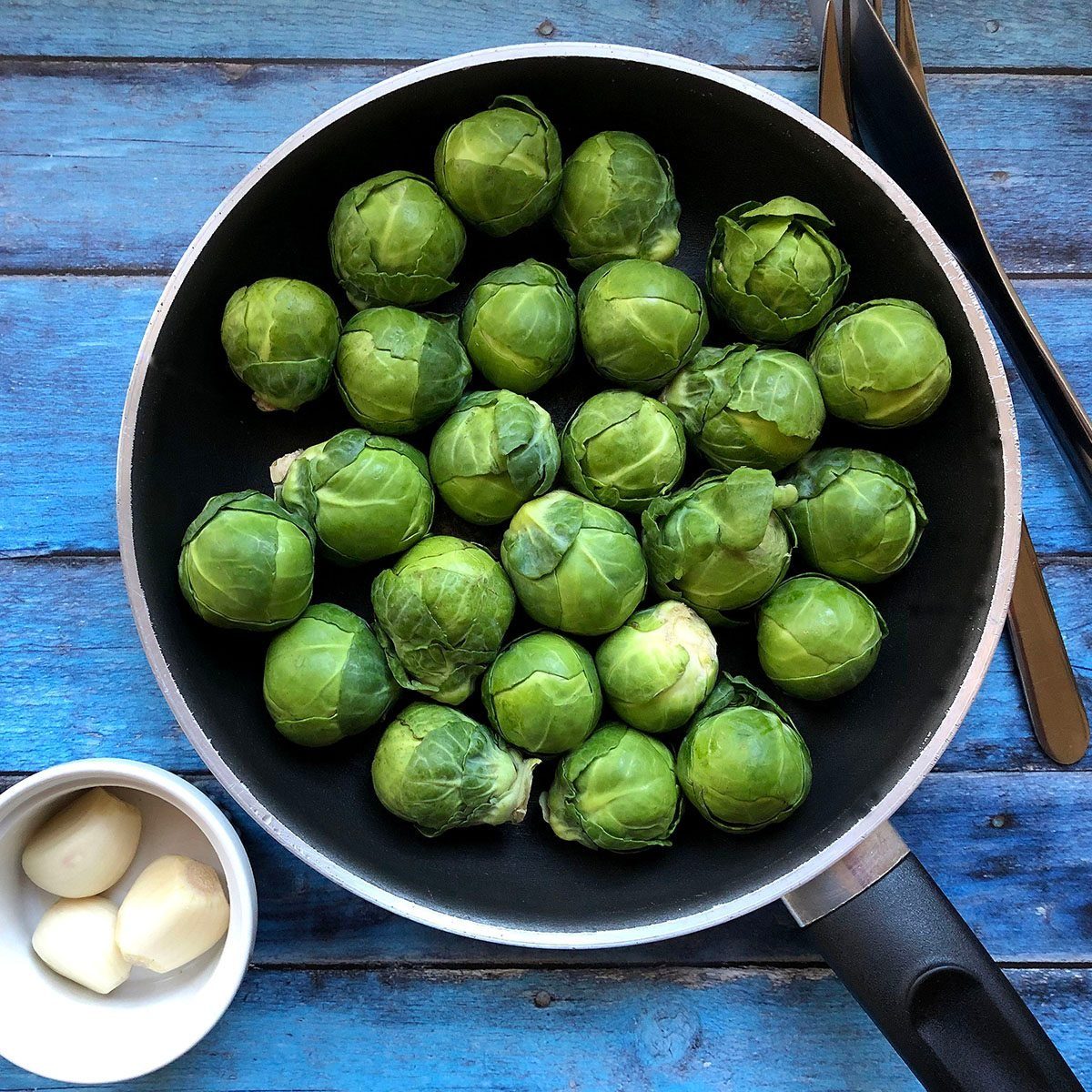 High Angle View Of Brussels Sprout In Frying Pan On Table