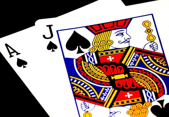 A jack and ace of spades in a deck of cards.