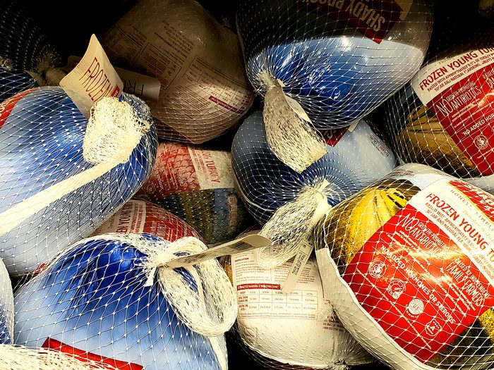 a pile of frozen Thanksgiving turkeys