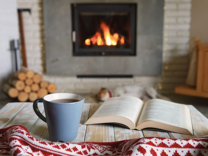 How to make your home cozy this winter - Hygge-inspired room with fireplace