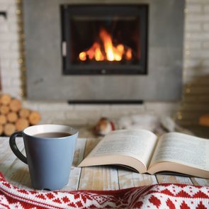 How to make your home cozy this winter - Hygge-inspired room with fireplace