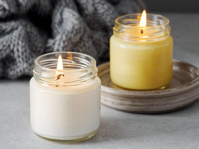 Trim candle wick - two jar candles burning