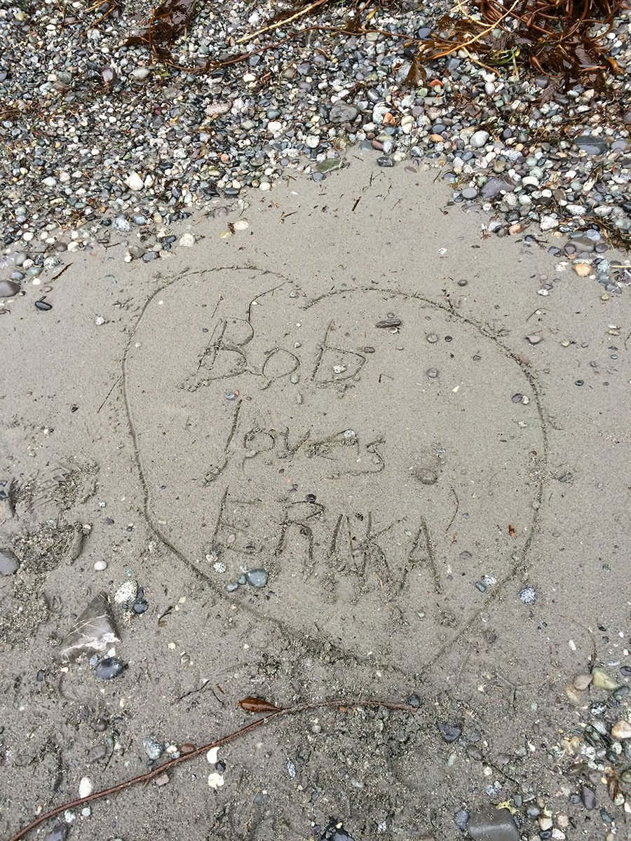 "Bob Loves Erika" written in the sand on Tofino Beach