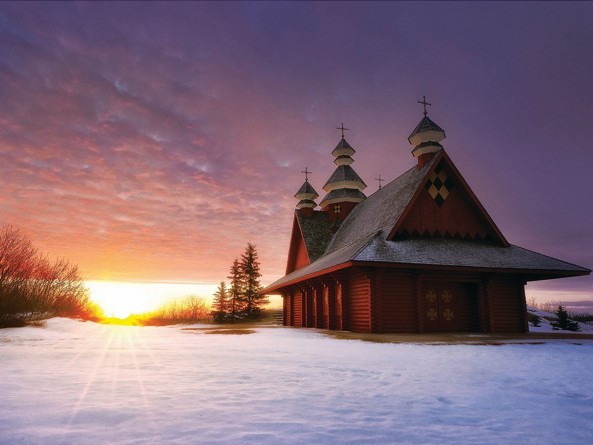 Sunset setting by small Ukrainain Church.