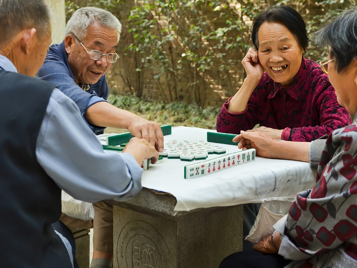 Mahjong Facts - Group of seniors playing mahjong