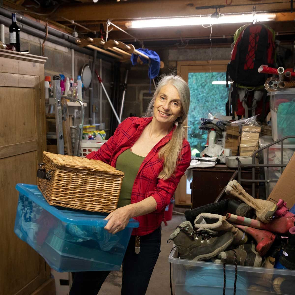 Woman sorting through garage clutter