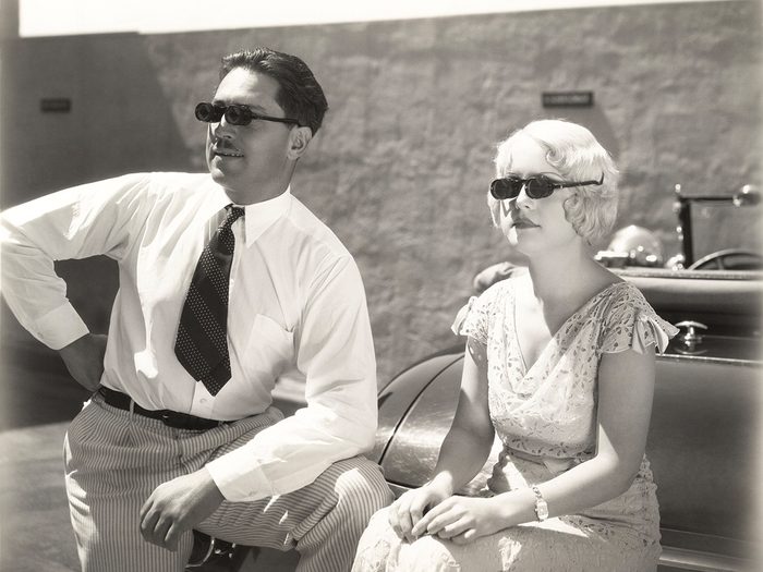 Couple wearing sunglasses - vintage photo