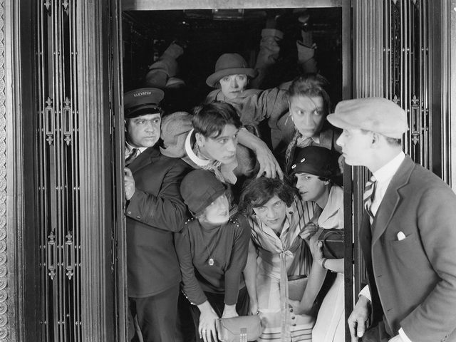 Crowded elevator - vintage photo