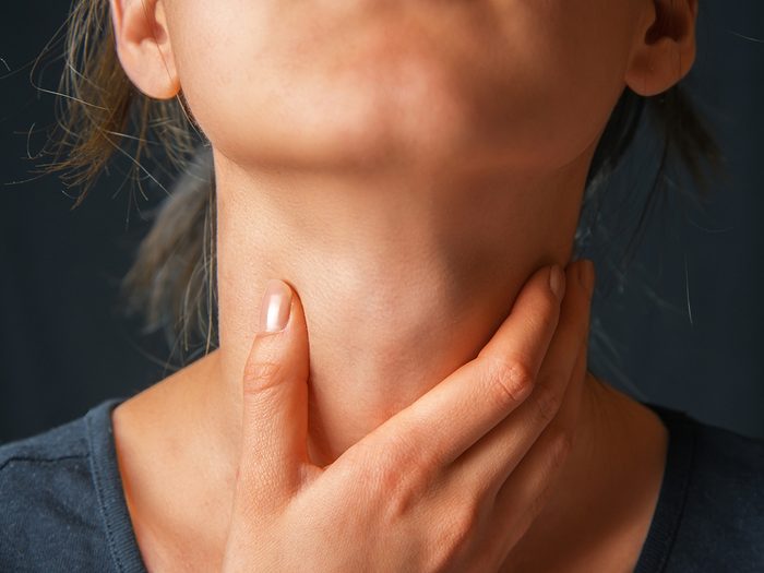 Cancer symptoms - woman with sore throat