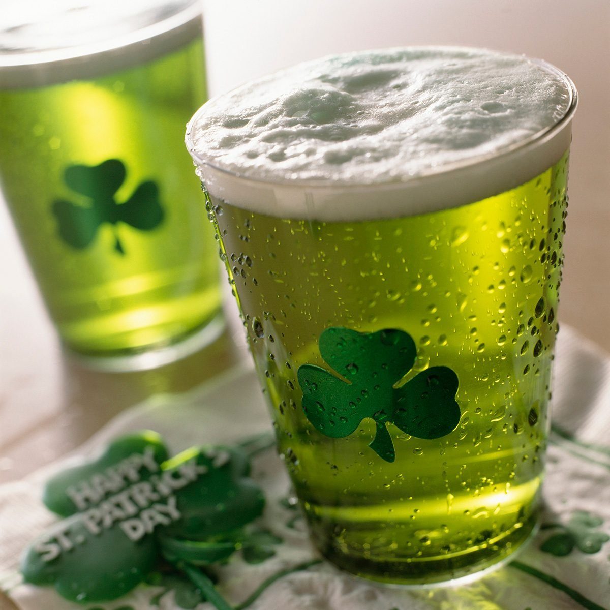 Close Up Of Beverages With Shamrocks On Glass