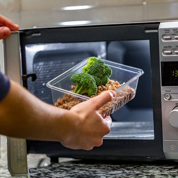 Man cooking dinner in microwave