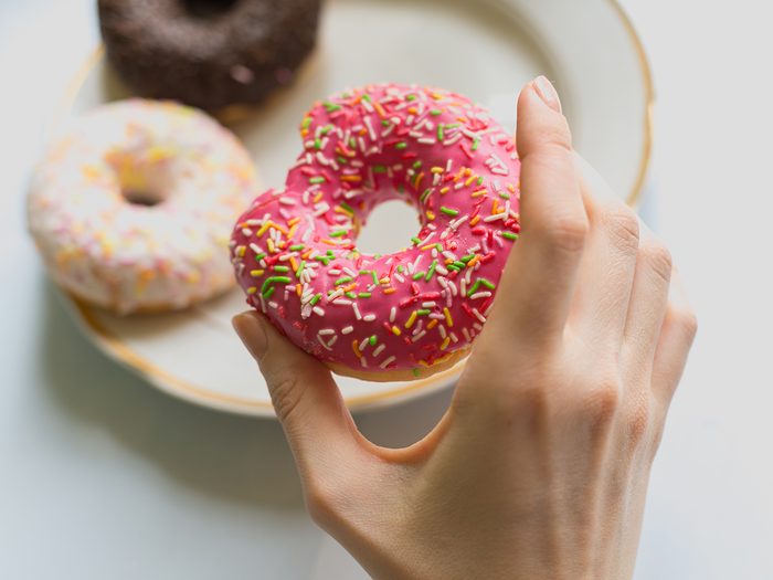 Signs of diabetes - reaching for donut