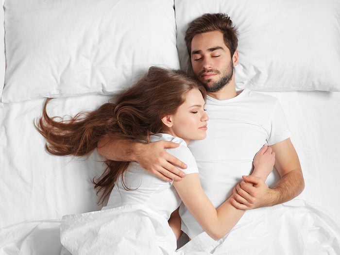 Healthy home checklist - couple sleeping on white bed