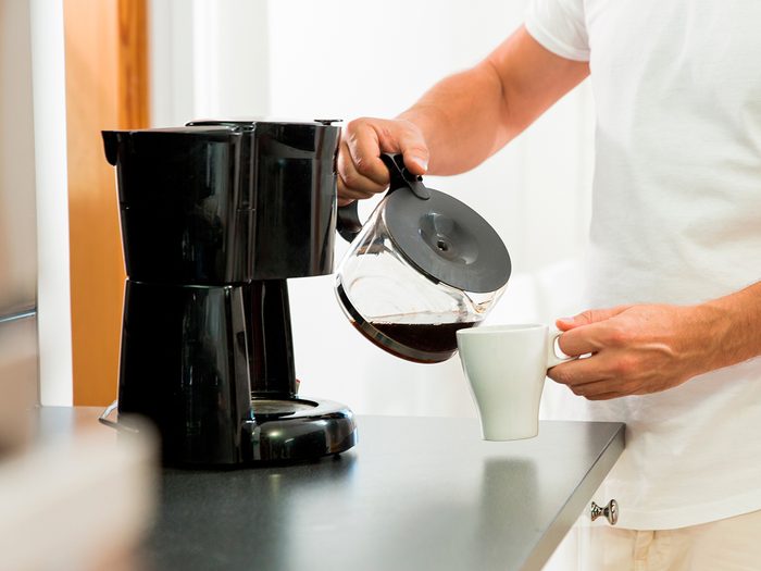 Mistakes everyone makes brewing coffee - man pouring coffee into cup