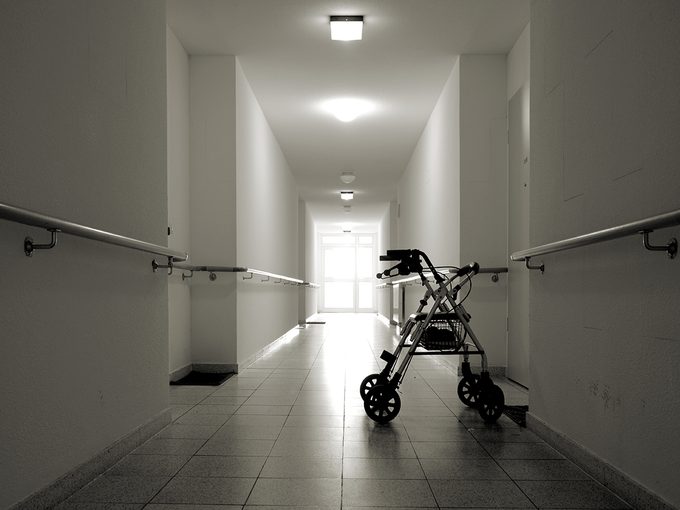 Walker in nursing home hallway