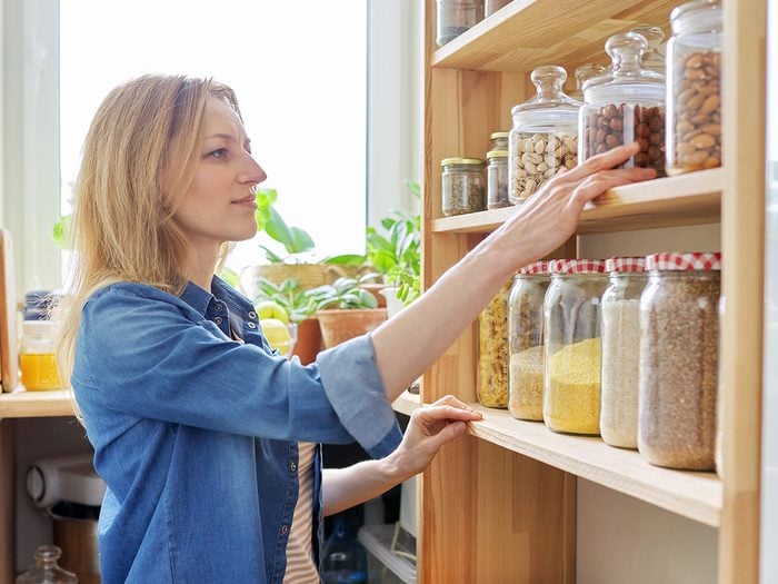 Woman organizing pantry