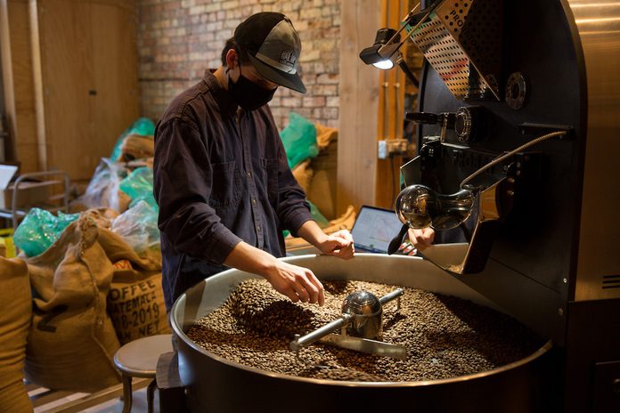 Roasting beans at the Rooftop Roasters cafe