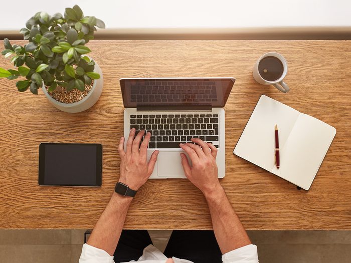 Real estate tips - man typing on laptop