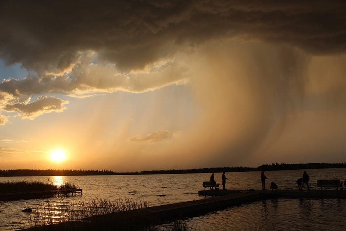 Weather Pictures - Rainfall At Sunset Over Lake