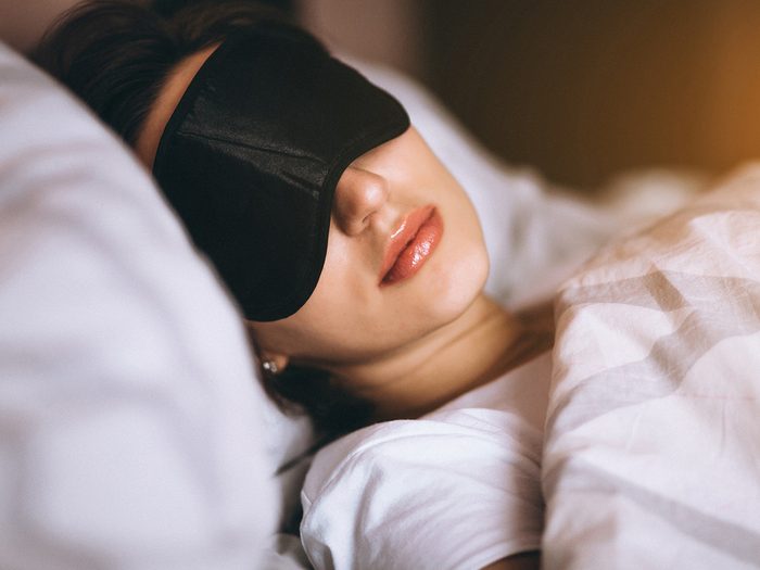 Sleeping woman in sleep mask