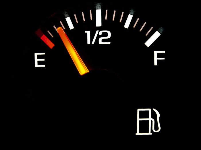 Car gas gauge nearing empty