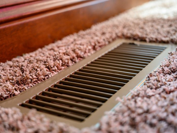 Air conditioning myths - air vent in carpeted floor