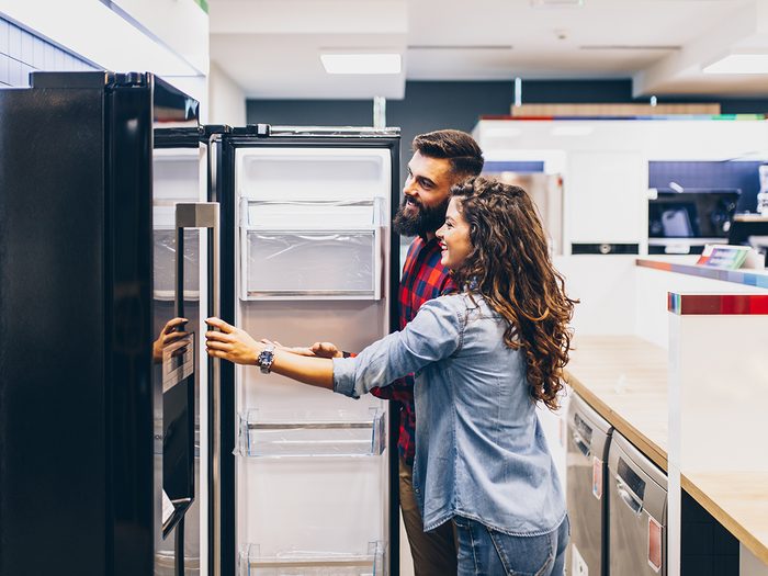 Appliance shortage - young couple buying new fridge