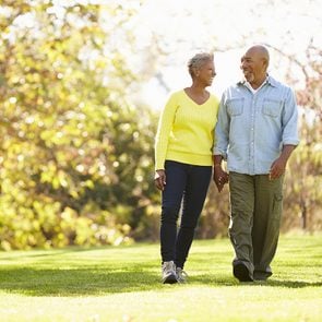 Relieve arthritis pain through exercise - mature couple walking